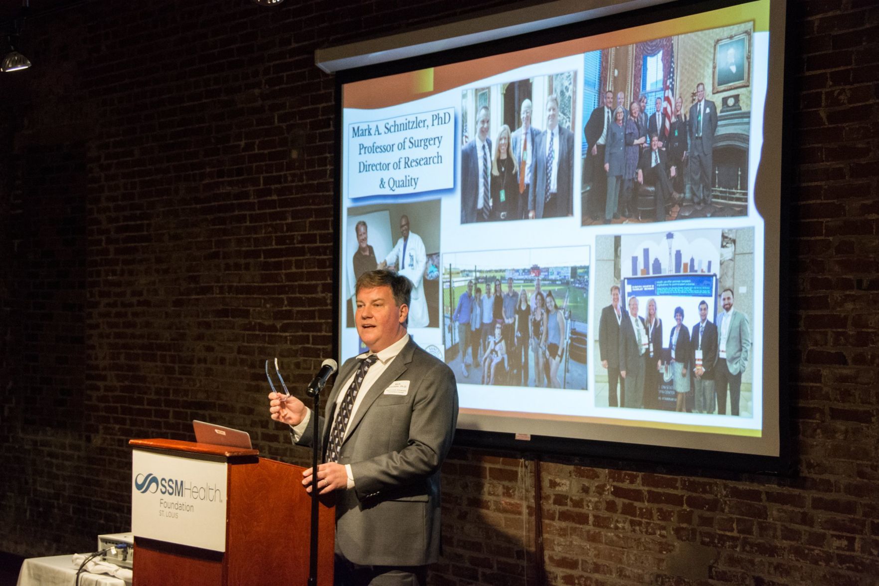 Dr. Mark Schnitzler, PhD, speaks at the event